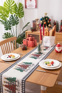 Detail of Christmas table runner with buffalo plaid tree and Merry & Bright lettering