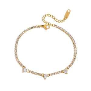 Elegant gold-plated tennis bracelet with three heart-shaped stones and round zircons