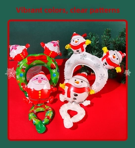 Detailed view of festive Santa and Snowman foil balloons for Christmas holiday celebrations