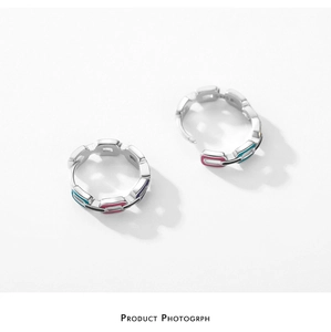 Close-up of S925 sterling silver hoop earrings with chain texture and colorful enamel