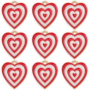 Macro shot of 9 red and white enamel heart charms in a 3x3 grid with gold alloy edges