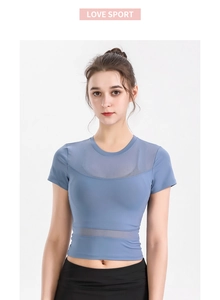 Close-up of fog blue breathable mesh stitching on athletic dry-fit yoga t-shirt