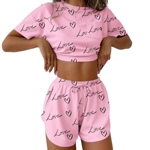 Pink two-piece summer loungewear set with Love print crop top and drawstring shorts