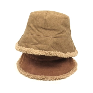 Winter corduroy bucket hat with warm lamb wool trim shown in brown and tan colors