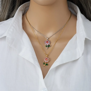 Elegant floral pendant necklace with zircon petals on model with white shirt background