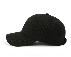 Detailed side view of thickened black woolen baseball cap with textured finish and side logo