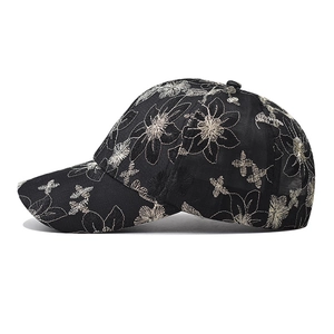 Fashionable black baseball cap with intricate flower embroidery and lace details