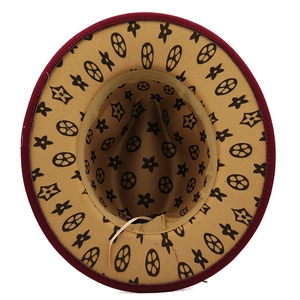 Top view of wide brim fedora hat showing khaki floral print lining and inner sweatband