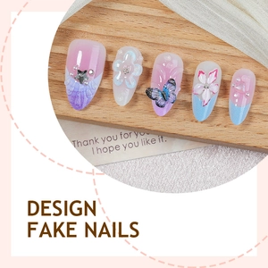 Handmade 3D floral press-on nails with butterfly charms and pearl accents in purple and blue