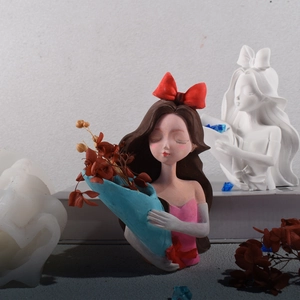 Three-stage DIY process showing silicone mold and painted girl figurine with red bow