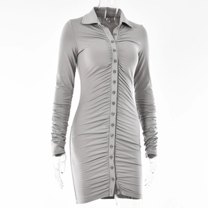Detailed view of light grey pleated long sleeve dress with button-down collar design