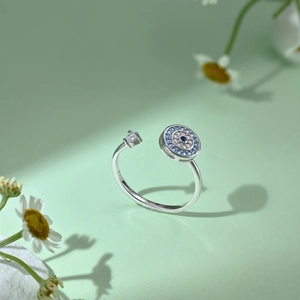 Macro shot of S925 sterling silver evil eye ring with blue and white cubic zirconia