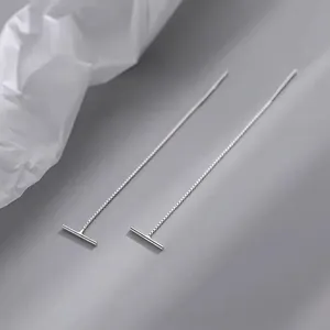 Minimalist S999 sterling silver T-bar long chain earrings on a modern grey background