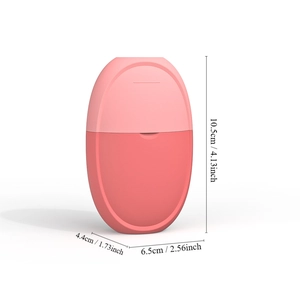 Detailed size dimensions of the pink facial ice roller massager shown in studio