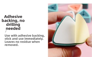 Close-up showing the strong adhesive backing removal of the triangle towel holder