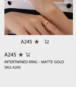 Close-up of golden crisscross infinity ring featuring a minimalist matte finish