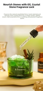 Close-up of essential oil dropper adding liquid to green crystal stones in a glass jar