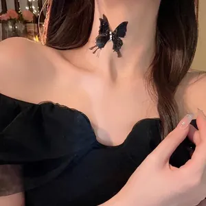 Sparkling black butterfly choker necklace with rhinestones on fashion female model