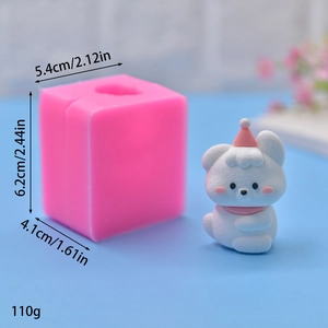 Detail view of pink silicone mold with 3D cartoon bear figure and size dimensions