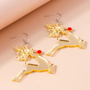 Close-up of cute golden reindeer earrings with a red nose and silver metal hooks
