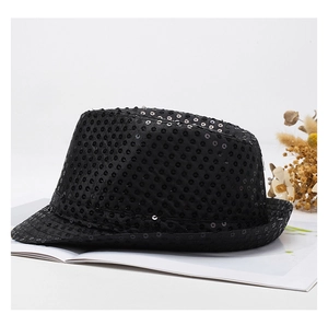 Detailed view of a black jazz hat with sequins and dried flower decoration