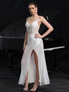 Elegant white sequin long dress with high slit and rhinestone mesh detail on dark background