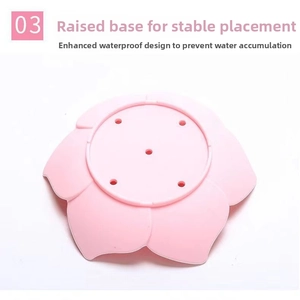 Detail view of the pink lotus soap dish showing its elevated base and drainage holes
