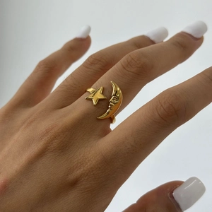 Gold star and moon open ring in 18k stainless steel on model hand for women