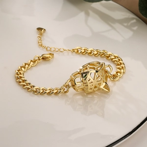 Chic gold-plated cuban chain bracelet featuring a geometric leopard head with green eyes
