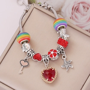 Detail of beaded snake chain bracelet with heart charms and crystal resin beads