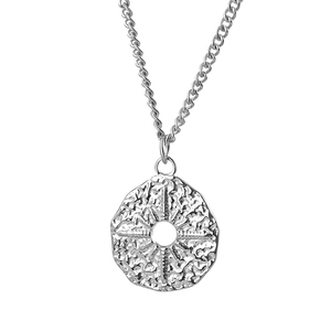 Vintage irregular silver sunburst star pendant on a classic curb chain necklace