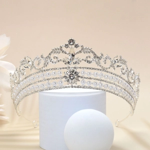 Detail of silver bridal crown with sparkling rhinestones and elegant white pearls