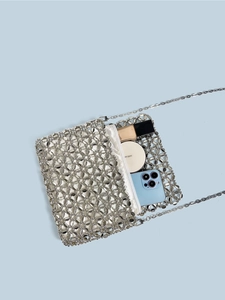 Silver beaded square handbag with white zipper pouch and metal chain strap for parties