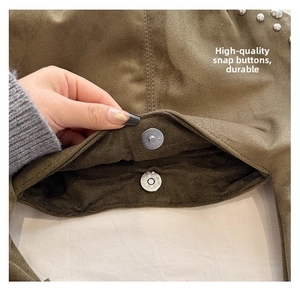 Detail showing high-quality silver magnetic clasp on an olive green suede handbag