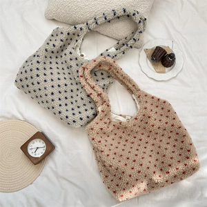 Detailed macro view of soft lamb hair fleece texture and polka dot pattern on tote bags