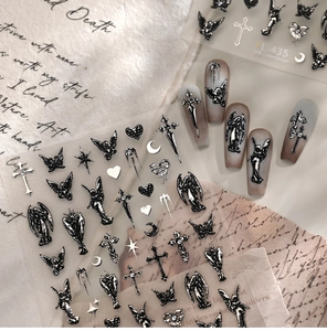 Macro view of TL-435 gothic nail stickers featuring black silver angels and crosses
