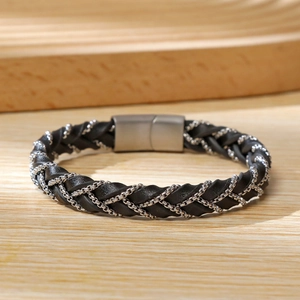 Close-up of woven black microfiber leather bracelet with a magnetic steel clasp