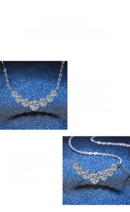 Macro view of premium moissanite pendant with curved arrangement on silver chain