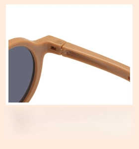 Detail of robust metal hinge on foldable khaki children sunglasses for smooth opening