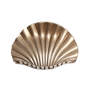 Golden shell-shaped plastic hair claw clip with glossy finish for women's hairstyle