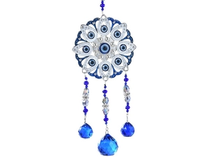 Detail of owl crystal suncatcher with blue evil eye beads and multifaceted prisms