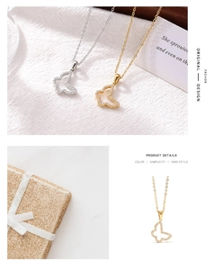 Close-up of butterfly pendants in gold and silver finish with micro-pave zircon crystals
