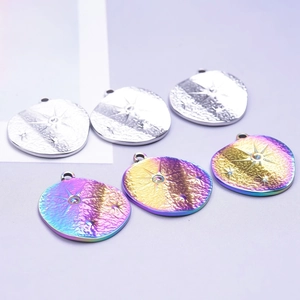 Detailed view of stainless steel star pendants in silver and rainbow iridescent finishes