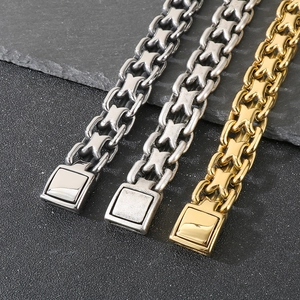 Detail of industrial stainless steel curb chains in silver, vintage silver, and gold finishes