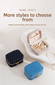 Mini travel jewelry box showing ring slots and necklace hooks in three colors