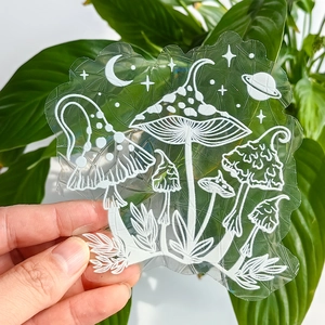 Rainbow prism suncatcher film with mushroom and celestial moon patterns on glass