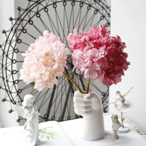 Vintage coral hydrangea artificial flowers in hand-shaped white ceramic vase