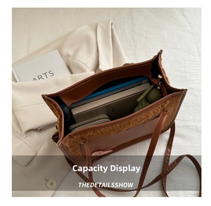 Interior view showing the large capacity of the plush tote bag with daily essentials