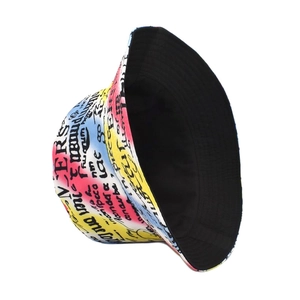 Detail view of double-sided fisherman hat with vibrant graffiti print and black lining