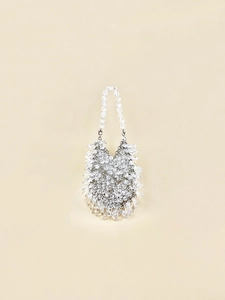 Detailed close-up of handmade acrylic crystal beaded handbag with faceted clear beads